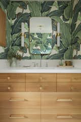 Custom vanity with hardware and lighting from Rejuvenation 