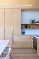 Kitchen, Subway Tile Backsplashe, Engineered Quartz Counter, Wall Oven, Cooktops, Wood Cabinet, Refrigerator, Light Hardwood Floor, and Ceramic Tile Backsplashe  Photo 19 of 27 in Gold Country Retreat by brian pearson