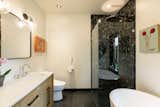 Natural fossil marble shower, heated bathroom floors, Toto toilets