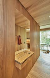 Hallway and Medium Hardwood Floor Details from the entrance area with a key rack, flush recessed mirror and coat rack  Photo 2 of 21 in Penthouse in a Park by SHIRVANI & OESTERLE