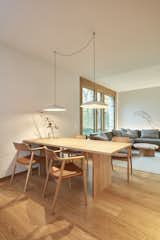 The dining space features a solid oak table and Japanese-manufactured armchairs.