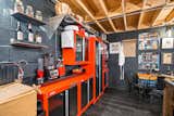 Craftsman metal cabinets with custom steel attachments to make them deeper with a bamboo sink and exposed beams  Photo 3 of 10 in The Warehouse Kitchen by Joseph Zappoli