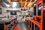Hanging pots and knife magnetic wall Mount set floating soffit with special lighting and the TV to watch your culinary experience  Photo 4 of 10 in The Warehouse Kitchen by Joseph Zappoli