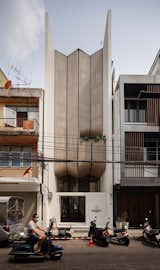 Exterior, Flat RoofLine, Glass Siding Material, Wood Siding Material, and Concrete Siding Material The narrow entrance of Double B Hostel, with its curved wooden facade contrasting yet complementing the surrounding traditional shophouses, inviting a blend of the old and new in Bangkok's historic district.  Photo 3 of 24 in Double B Hostel by Vichayuth Meenaphant