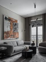 Living Room, Pendant Lighting, Sofa, and Coffee Tables Living area. Chandelier Drop Chandelier by 101 Copenhagen.  Search “北京到沈阳北火车站时刻表D101【精仿++微wxmpscp】” from Apartment in dark colors