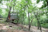 Exterior, Vinyl Siding Material, Saltbox RoofLine, Metal Roof Material, and House Building Type  Photo 2 of 9 in Secluded Ozark Mountains Treehouse by Emily Carr