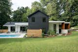 Exterior back of home showing existing portion in black, pool and zen garden off of the primary suite.