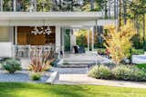 Exterior, Stucco Siding Material, Flat RoofLine, and Mid-Century Building Type Landscape to pool house.  Photo 7 of 11 in The Modernist Pool House by Wayne Truax