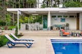 Windows Pool deck to outdoor kitchen.  Photo 8 of 11 in The Modernist Pool House by Wayne Truax