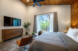 Bedroom #2: King bed, 65” Smart TV, ceiling fan, seating area, dresser, nightstands w/ lamps, ensuite bathroom with walk-in rainfall shower, soaking tub, walk-in closet.