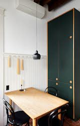 Custom linoleum cabinets, pegboard rail. 