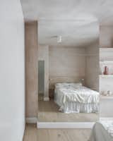Bedroom, Light Hardwood Floor, Bed, Recessed Lighting, Dresser, Shelves, Accent Lighting, and Ceiling Lighting  Photo 13 of 25 in Heyford Avenue by Manuel Urbina
