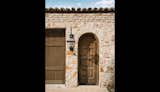 Exterior, Stone Siding Material, Wood Siding Material, House Building Type, and Tile Roof Material Garage Door  Photo 3 of 23 in Tuscan Villa by J Christopher Architecture