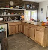 Kitchen, Wood Counter, Wood Cabinet, Microwave, Cooktops, Ceiling Lighting, Refrigerator, and Range Kitchen  Photo 10 of 13 in The Shack by Rich N
