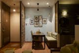 Dining Room, Bench, Terra-cotta Tile Floor, Pendant Lighting, Table, Lamps, and Chair Transition of spaces  Photo 7 of 27 in The Pot House by Tina Kedia