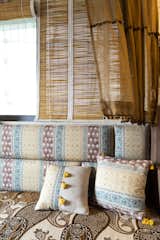 Naturally dyed linen curtains over bamboo blinds