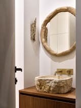 Elements of eco-style in the interior of the guest bathroom.