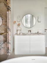 Bath Room, Porcelain Tile Floor, Marble Counter, Undermount Sink, and Wall Lighting Master bathroom.   Photo 18 of 20 in Charming apartment with a touch of Bali's serenity by Maria Ushakova by Anna Maria Abara