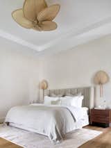 The lighting solution in the bedroom is represented by chandeliers and sconces custom-made in Thailand.