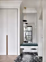 Hallway, Light Hardwood Floor, and Porcelain Tile Floor Entrance area.  Photo 2 of 16 in Stylish French-inspired apartment in Moscow by Anna Maria Abara