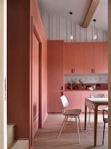 Kitchen and dining area.  Photo 10 of 20 in Colorful two-level apartment with expressive palette by Anna Maria Abara