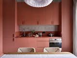 Kitchen area.  Photo 11 of 20 in Colorful two-level apartment with expressive palette by Anna Maria Abara