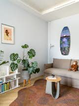 Coffee table by MDF Italia.
Carpet by Ami Carpets.
The shelving and sofa are the property of the owner.
Floor lamp by Flos.