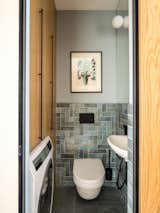 Guest bathroom-laundry room.
Porcelain stoneware by Equipe and Marazzi
Sconce by Lightstar
Graphics “Bouquet from the head" by Alexander Biruk