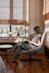 The owner of the apartment in the lounge area.