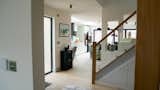 Staircase, Wood Tread, and Glass Railing Entrance into the open plan living space  Photo 2 of 12 in The Swale self-build by Deborah Hastie
