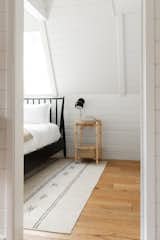 Bedroom, Bed, Wall Lighting, Light Hardwood Floor, and Night Stands  Photo 10 of 14 in A-Frame Haus by Kara James