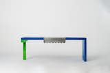 Duality Bench
The bench is hand-crafted from natural pine wood with lacquered finish in a striking royal blue color with 
an accent ‘’T’’ leg in acid green color.
The metal cover is made from a raw sheet steel with laser- cut scalloped edges as a contrasting element to 
the contemporary appeal of the bench.
