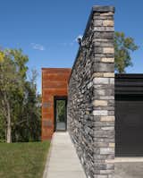 Exterior, Flat RoofLine, Metal Siding Material, Stone Siding Material, and House Building Type  Photo 2 of 11 in Aljo Tree House by Cipriani Studios by Cipriani Studios