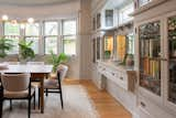 The dining room showcases the original built-ins and a sizable pocket door. Quartersawn meticulously restored the original pocket door to its former glory, incorporating a soft-close feature. 