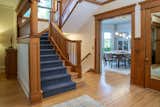 To enhance functionality, the secondary staircase was removed, and a new staircase was added beneath the existing primary stairs. It was important to the homeowners that this blended seamlessly, so Quartersawn crafted a custom newel post and millwork to match the original architecture.