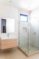 Bath Room, Light Hardwood Floor, Corner Shower, Enclosed Shower, Drop In Sink, Mosaic Tile Wall, and Granite Counter  Photo 12 of 29 in Casa Punta Azul by Erika Lin