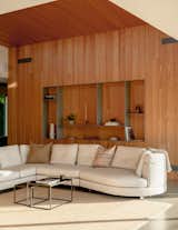 Lounge with timber lined feature wall and shelving at Penrith Peaks