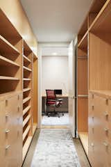 Office A dream closet with lots of storage is just beyond the office.  Photo 10 of 11 in Living in the Sky by Bjorn Design