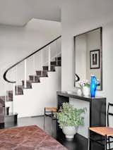 Staircase Playing off the homeowner’s photography collection, we created a clear black and cream color palette. The refinished floors were stained an ebony finish, and the dark stair runner provides texture and depth.  Photo 14 of 16 in Modernism Revisited by Bjorn Design