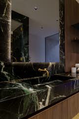 Bath Room, Marble Wall, Drop In Sink, Ceiling Lighting, Accent Lighting, Enclosed Shower, Stone Slab Wall, and Marble Counter  Photo 9 of 18 in Arroyo Vista by IA Design Studio