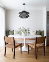 Dining nook framed by pillows made from Zak + Fox fabric