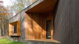Strategic placements of stained STK cedar highlight a series of carvings into and projections from the building’s structure that bridge the relationship between indoor and outdoor living.   Photo 3 of 12 in Seelbach Lane Residence by JSDnA