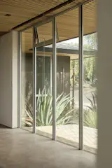 Mimicking the look of floor-to-ceiling windows in midcentury homes was important to Nugent. The windows and doors are from Styline.