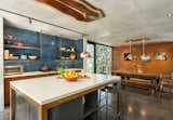 Dining Room, Table, Chair, Concrete Floor, Ceiling Lighting, and Lamps  Photo 4 of 8 in Conacaste House by Elastica Studio