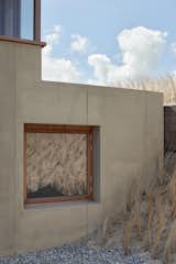 Exterior, Beach House Building Type, and Concrete Siding Material Detail of lower level window  Photo 5 of 14 in House in the Dunes by Daan Vulkers