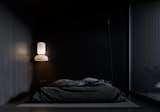 Bedroom, Dark Hardwood Floor, Bed, Night Stands, Floor Lighting, and Pendant Lighting Cabin 1 bedroom  Photo 5 of 10 in Rzhyshchiv Cabins by Shovk Studio