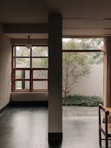 Windows, Wood, and Single Hung Window Type VIEW OF THE COURTYARD AS SEEN FROM LIVING AND DINING ROOM  Photo 6 of 9 in HOUSE IN SALVADOR DO MUNDO by Yatin Fulari