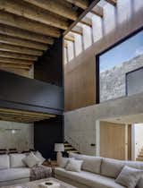 Living Room, Wood Burning Fireplace, Standard Layout Fireplace, Ceiling Lighting, Concrete Floor, Accent Lighting, and Sofa  Photo 5 of 19 in Noah House by Cadaval Estudio
