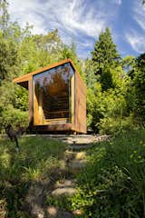 Outdoor, Woodland, Hot Tub Pools, Tubs, Shower, Back Yard, Trees, and Metal Patio, Porch, Deck Sauna resting in the forest  Photo 1 of 6 in Lake Sauna by E. Cobb Architects