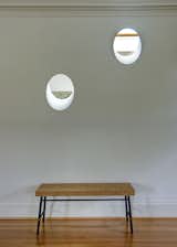 Portals bring light to adjacent spaces from the overhead skylight
